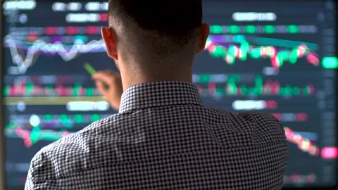 Currency Trader Analyzing Data On Multiple Screens At Desk 스톡 동영상 199094043