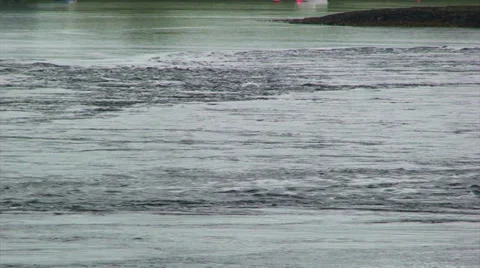 Current and water mixing during falling tide at fjord mouth Stock Footage 39816120