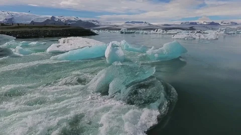 The current flows around the blue glaciers in Iceland. Andreev. Stock Footage 78423171