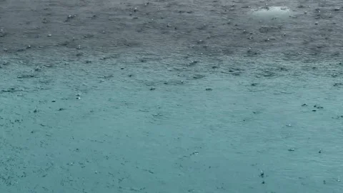 A current pool scene with heavy rain in the blue pool. Stock Footage 323322968