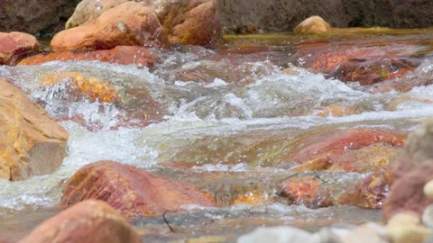The current of a river flowing over rocks and stones Stock Footage 335892144