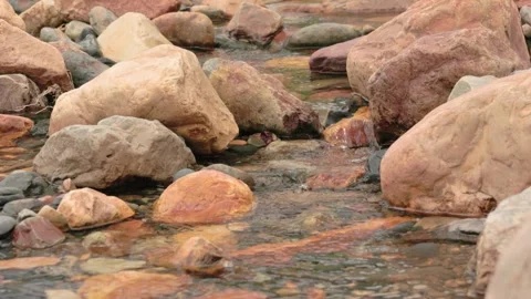 The current of a river flowing over rocks and stones Stock Footage 335892305