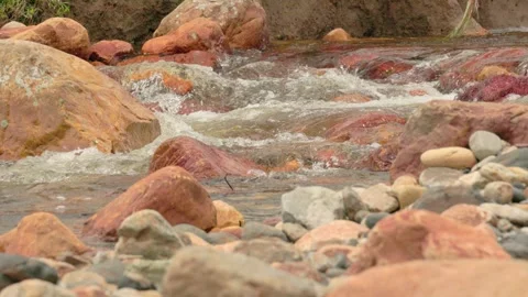 The current of a river flowing over rocks and stones Stock Footage 335892306