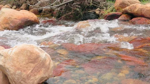 The current of a river flowing over rocks and stones Stock Footage 335894145