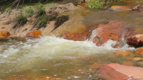 The current of a river flowing over rocks and stones Stock Footage 335894286