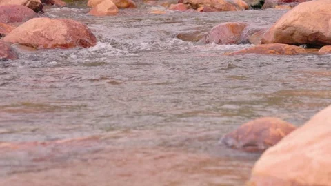The current of a river flowing over rocks and stones Stock Footage 335895572