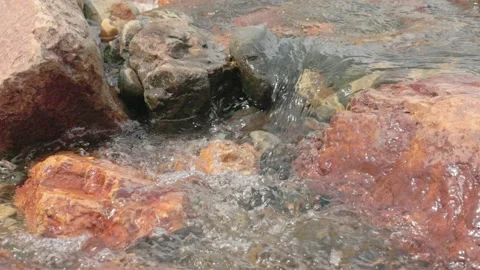The current of a river flowing over rocks and stones Stock Footage 335896191