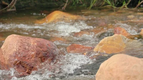 The current of a river flowing over rocks and stones Stock Footage 335896214
