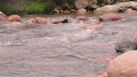 The current of a river flowing over rocks and stones Stock Footage 335896340
