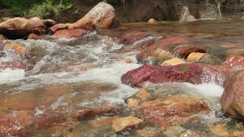 The current of a river flowing over rocks and stones Stock Footage 335896949