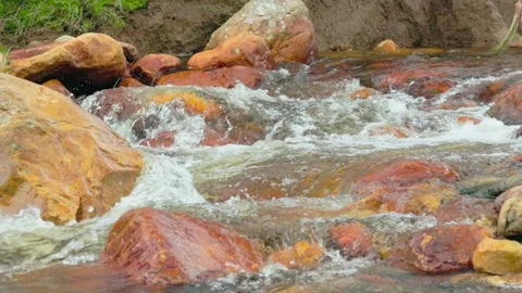 The current of a river flowing over rocks and stones Stock Footage 335896989