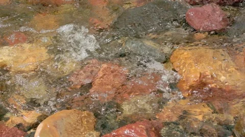 The current of a river flowing over rocks and stones Stock Footage 335897234