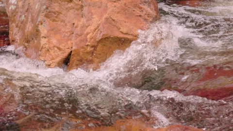 The current of a river flowing over rocks and stones Stock Footage 335897256