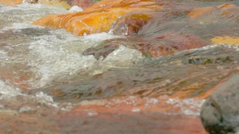 The current of a river flowing over rocks and stones Stock Footage 335897801