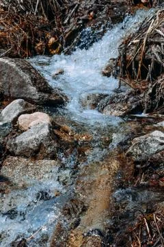 Current of the river on mountain rocks in the daytime Stock Photos