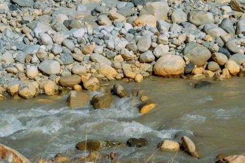 Current of the river on mountain rocks in the daytime Stock Photos