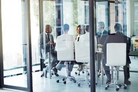 This is the current state of operations. a team of professionals having a Stock Photos