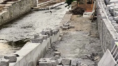 The current status regarding the construction progress on the Waterway Stock Footage 318499365
