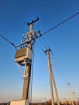 Current transformer, high voltage electric lines on sky background Stock Photos