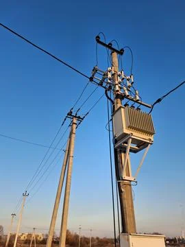 Current transformer, high voltage electric lines on blue background Stock Photos