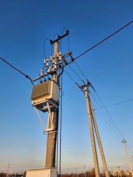 Current transformer on post with high voltage electric lines Photos