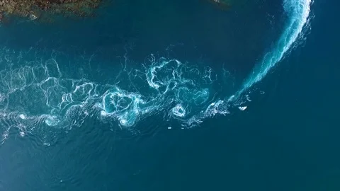Currents and whirlpools created by the ebbing tide in the Kimberley Stock Footage 118817498