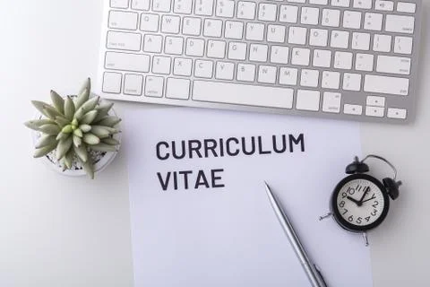 Curriculum vitae with pen and computer keyboard on white table, top view Stock Photos