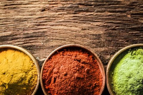 Curry, chilli and ground green tea Stock Photos