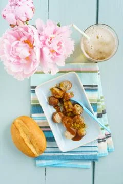 Currywurst with bread roll Stock Photos