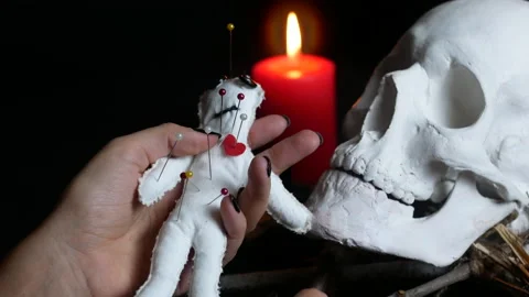 Cursing a man with a voodoo doll Stock Footage 234986308