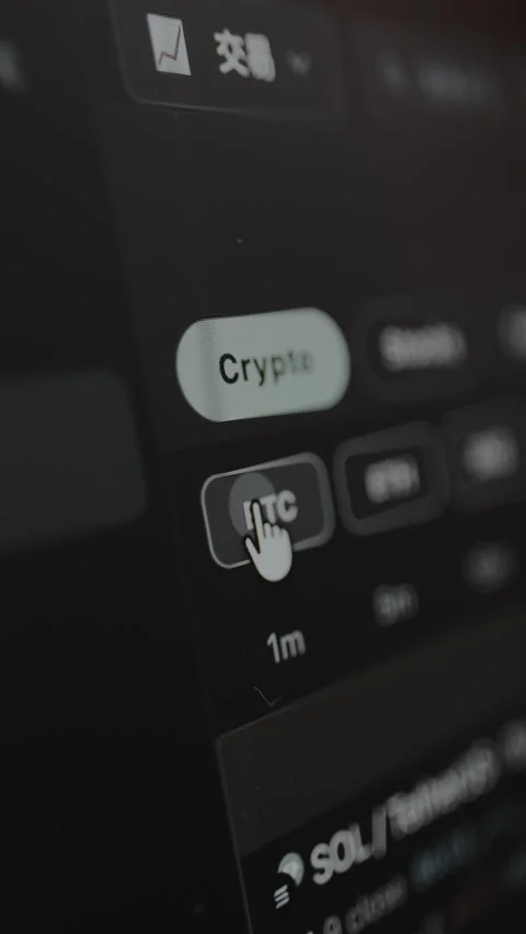 The cursor clicks the BTC button within a trading platform interface Stock Footage 328863364