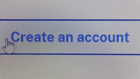 The cursor hovers over the CREATE AN ACCOUNT button, wanders over it and clicks. Stock Footage 238797681