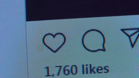 The cursor hovers over the heart and puts a like. Stock Footage 127284632