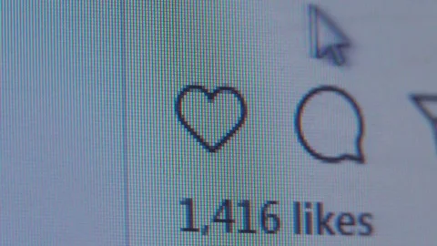 The cursor hovers over the heart and puts a like. Stock Footage 127284676