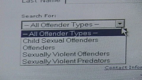 Cursor Selects Dropdown Menu on 2009 Online Sex Offender Database Video stock 107395835