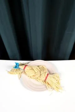 Curtain and spaghetti braid Stock Photos