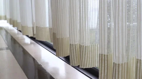 Curtain beside the window Stock Footage 63378195