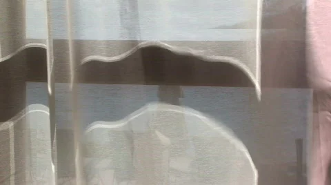 A curtain blowing in the wind with beach in background 스톡 동영상 574244