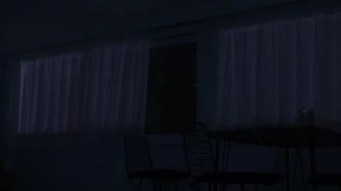 A curtain in a dark room Stock Footage 266985894