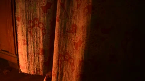 Curtain in a draft in the flickering light of a flame Stock Footage 143258630