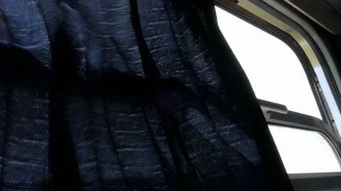 Curtain fluttering in the wind in window of old type of train Stock Footage 93077862
