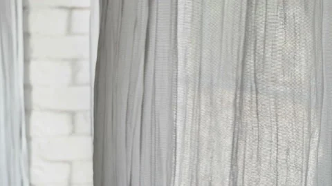 Curtain fluttering in the wind at the window. Wind at the window Stock Footage 122927781
