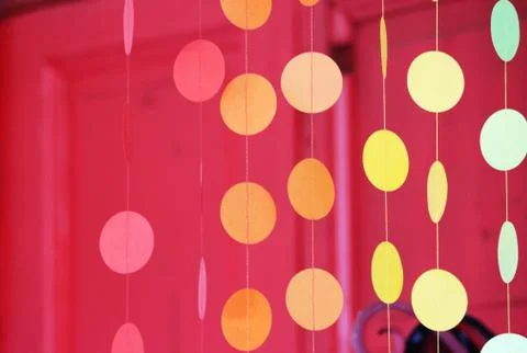Curtain of multi-colored circles suspended on threads and attached to a plast Free Stock Photos