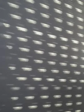 Curtain pattern light over interior wall Stock-Fotos