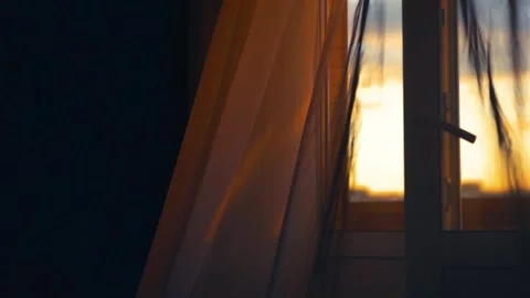 A curtain in the wind by the window at sunset Video stock 333206343