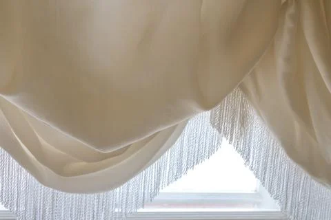 The curtain in the window waves collected by the Stock Photos