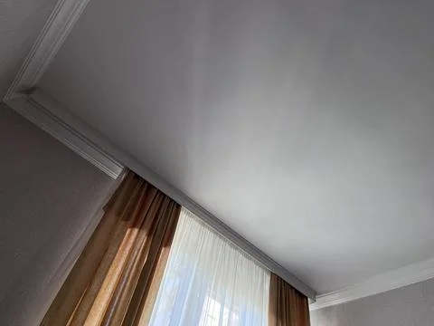 Curtained window with light through sheer drapes Stock Photos