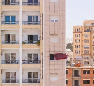Curtains blowing in the wind outside the window Stock Photos
