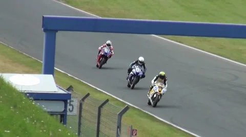 Curve racing at Motorbike and Superbike motorsports racing Stock Footage