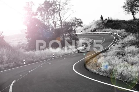 Curve road in the mountain and forest, country road in north of Thailand Stock Photos